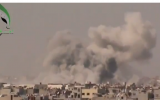 Smoke rising from a bombing in Damascus on September 19. (photo credit: Image capture from YouTube video uploaded by Freeeeelibyan)