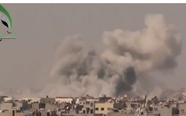 Smoke rising from a bombing in Damascus on September 19. (photo credit: Image capture from YouTube video uploaded by Freeeeelibyan) Smoke rising from a bombing in Damascus on September 19. (photo credit: Image capture from YouTube video uploaded by Freeeeelibyan)