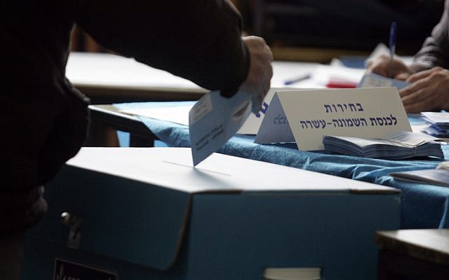 Illustrative: A voter casts a vote in a ballot box during Knesset elections on February 10, 2009. (Yossi Zamir/Flash90) Illustrative: A voter casts a vote in a ballot box during Knesset elections on February 10, 2009. (Yossi Zamir/Flash90)