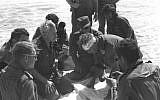 Former chief of staff Haim Bar-Lev, center left, consults with Maj. Gen. Ariel Sharon (with bandage) and Moshe Dayan, center, during the 1973 Yom Kippur War. (photo credit: GPO/Flash90)