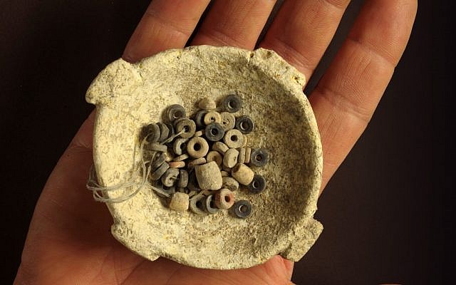 A bowl with stone beads dates to an ancient culture that flourished in modern-day Israel 7,000 years ago (photo credit: Courtesy of the Israel Antiquities Authority/Clara Amit) A bowl with stone beads dates to an ancient culture that flourished in modern-day Israel 7,000 years ago (photo credit: Courtesy of the Israel Antiquities Authority/Clara Amit)