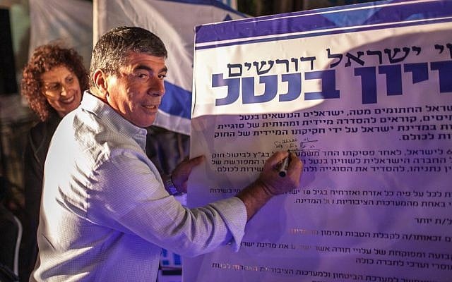 Is that document real? The final draft regarding the Harpaz Affair is almost complete.  Here former IDF Chief Gabi Ashkenazi signs his name for universal service.  (photo: Noam Moskowitz/FLASh90)