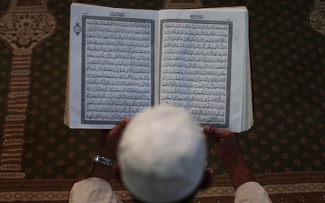 A Palestinian Muslim reads the Holy Quran at the Al-Omari mosque in the Gaza Strip. (photo credit: Wissam Nassar/Flash90) A Palestinian Muslim reads the Holy Quran at the Al-Omari mosque in the Gaza Strip. (photo credit: Wissam Nassar/Flash90)