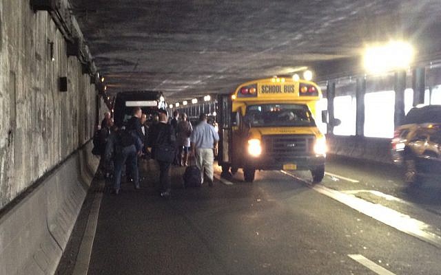 Israeli journalists stranded on FDR Drive, about to board a school bus to take them to the UN (photo credit: Raphael Ahren/Times of Israel)