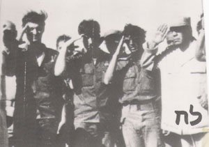 Ehrenfeld, middle, and the Egyptian colonel, left, saluting the Egyptian flag (Photo credit: Courtesy: Erim Balaila)