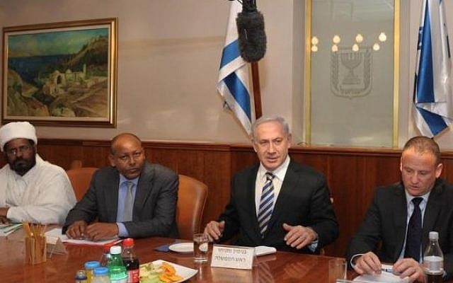 Aleli Admasu (second from left) sits next to Prime Minister Benjamin Netanyahu (photo credit: Facebook)