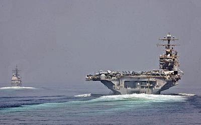 Illustrative: The guided-missile cruiser USS Cape St. George and the aircraft carrier USS Abraham Lincoln transit the Strait of Hormuz. (CC-BY SA 3.0/Official US Navy Imagery)