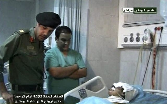 This video image broadcast Wednesday Aug. 10, 2011 by Libyan TV purports to shows Moammar Gadaffi's youngest son Khamis, left, visiting an injured man in a hospital in Tripoli, Libya on Tuesday Aug. 9, 2011 (photo credit: AP/LIbyan TV) This video image broadcast Wednesday Aug. 10, 2011 by Libyan TV purports to shows Moammar Gadaffi's youngest son Khamis, left, visiting an injured man in a hospital in Tripoli, Libya on Tuesday Aug. 9, 2011 (photo credit: AP/LIbyan TV)