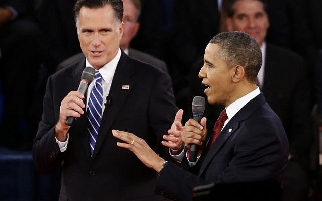 US President Barack Obama and Republican presidential candidate and former Massachusetts governor Mitt Romney speak during the second presidential debate at Hofstra University in Hempstead, New York on Tuesday. (photo credit: Charles Dharapak/AP)