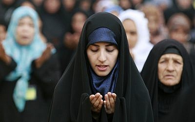 Iraqi Shiite women attend Eid al-Adha prayers in Baghdad last year (photo credit: AP/Hadi Mizban)