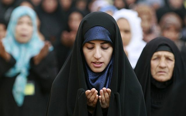 Iraqi Shiite women attend Eid al-Adha prayers in Baghdad last year (photo credit: AP/Hadi Mizban)