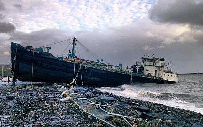 A 168-foot water tanker, the John B. Caddell, sits on the shore Tuesday morning, Oct. 30, 2012 where it ran aground on Front Street in the Stapleton neighborhood of New York's Staten Island as a result of superstorm Sandy. (photo credit: Sean Sweeney/AP)