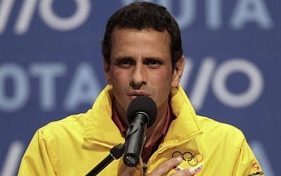 Opposition presidential candidate Henrique Capriles talks to supporters and media members as he concedes defeat in the presidential elections at his campaign headquarters in Caracas, Venezuela, Sunday, Oct. 7, 2012. Venezuela's electoral council said late Sunday President Hugo Chavez has won re-election, defeating challenger Capriles. (photo credit: AP Photo/Ariana Cubillos)
