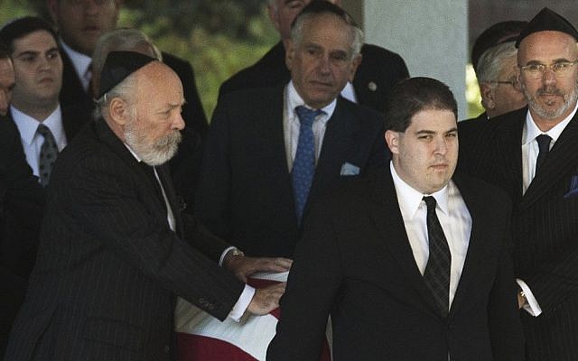 The flag-draped coffin of former US Sen. Arlen Specter is taken from Har Zion Temple after his funeral, Tuesday, October 16, 2012, in Penn Valley, Pa. Family members say Specter died Sunday of complications from non-Hodgkin lymphoma. He was 82. (photo credit: AP/Matt Rourke)