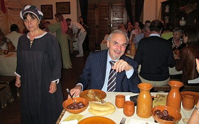 Historian Ariel Toaff prepares to taste a goose roasted in the style of medieval Italian Jews in Bevagna, Italy. (Ruth Ellen Gruber/JTA)