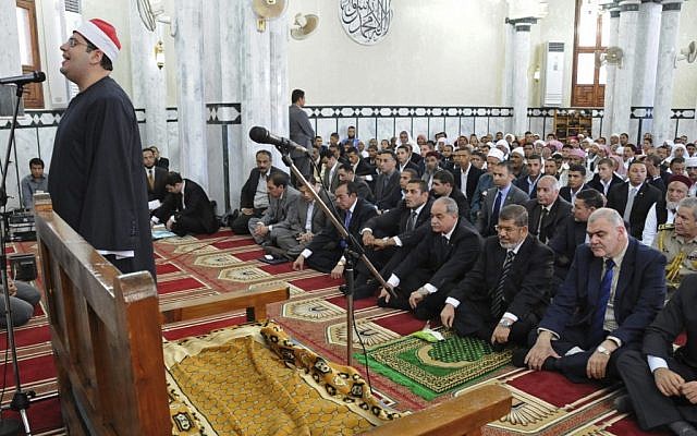 Egyptian President, Mohammed Morsi, front row second right, participates in Friday prayers in a mosque in Marsa Matruh, Egypt, Friday, Oct. 19 (photo credit: AP/Egyptian Presidency)