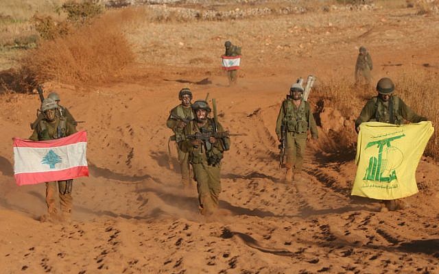 Israeli soldiers with Lebanon and Hezbollah flags returning from southern Lebanon on the last day of the 2006 war (Photo credit: Pierre Terdjman/ Flash 90) Israeli soldiers with Lebanon and Hezbollah flags returning from southern Lebanon on the last day of the 2006 war (Photo credit: Pierre Terdjman/ Flash 90)