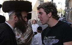 Illustrative: Ultra-Orthodox and secular Jewish men face off in Jerusalem, 2008. (Nati Shohat/Flash90)
