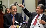 Defense Minister Ehud Barak, left, and Industry, Trade and Labor Minister Shalom Simhon, clowning together at a Knesset meeting in February 2010. (photo credit: Yossi Zamir/Flash90)