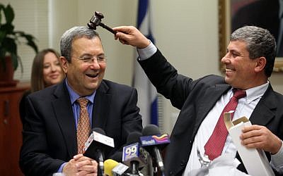 Defense Minister Ehud Barak, left, and Industry, Trade and Labor Minister Shalom Simhon, clowning together at a Knesset meeting in February 2010. (photo credit: Yossi Zamir/Flash90)