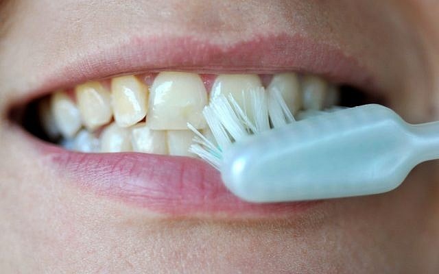 Illustrative photo of a woman brushing her teeth. (photo credit: Sophie Gordon/Flash 90) Illustrative photo of a woman brushing her teeth. (photo credit: Sophie Gordon/Flash 90)