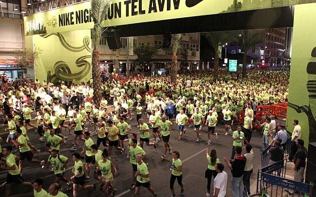 Runners at Rabin Square during the 2011 Nike Night Run (photo credit: Meir Partush/Flash90) Runners at Rabin Square during the 2011 Nike Night Run (photo credit: Meir Partush/Flash90)