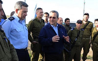 Defense Minister Ehud Barak visits an Iron Dome station in southern Israel in March. (photo credit: Ministry of Defense/Flash90)