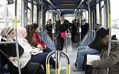 Ultra-Orthodox Jews and Arabs ride the Jerusalem light train on March 15, 2012 (photo credit: Miriam Alster/Flash90)