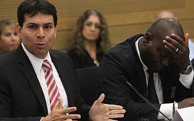 Danny Danon, left, attends a Knesset debate regarding the Sudanese refugees in Israel. To his right, the consul from Ivory Coast Consul seems exasperated. (photo credit: Miriam Alster/Flash90)