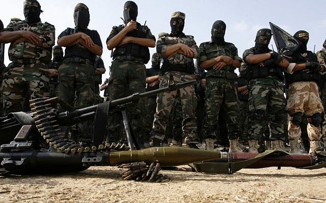 Palestinian Islamic Jihad militants pray during a rally marking the 17th anniversary of the killing of Fathi Shiqaqi, the militant movement's founder, in Rafah, October 2 (photo credit: Abed Rahim Khatib/Flash 90) Palestinian Islamic Jihad militants pray during a rally marking the 17th anniversary of the killing of Fathi Shiqaqi, the militant movement's founder, in Rafah, October 2 (photo credit: Abed Rahim Khatib/Flash 90)