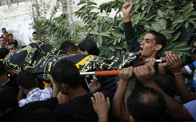 Palestinians carry the body of Abdullah Maqawi during his funeral in the town of Rafah in southern Gaza Strip on Monday. (photo credit: Abed Rahim Khatib / Flash 90)