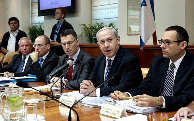 Israeli Prime Minister Benjamin Netanyahu (send from right) addresses the weekly cabinet meeting on Sunday. (photo credit: Marc Israel Sellem/Flash90).