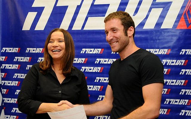National Union of Israeli Students Chairman Itzik Shmul shakes hands with Shelly Yacimovich as he joins the Labor Party, on October 17, 2012 (photo credit: Yossi Zeliger/Flash90)