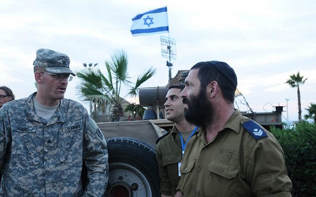 An American soldier talks to an Israeli solder during a joint exercise with the Patriot anti-missile system, in north Tel Aviv on October 24. (photo credit: Yossi Zeliger/Flash90) An American soldier talks to an Israeli solder during a joint exercise with the Patriot anti-missile system, in north Tel Aviv on October 24. (photo credit: Yossi Zeliger/Flash90)