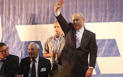 Prime Minister Benjamin Netanyahu waves to Likud members during the Likud convention in Tel Aviv. October 29, 2012. (photo credit: Roni Schutzer/Flash90)