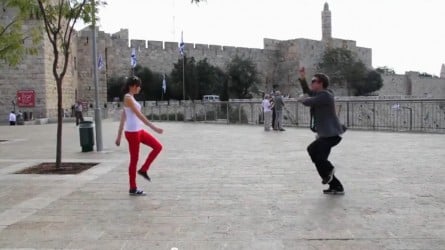 Josef Condiotti and Chen Perez dance outside the Old City walls (screen capture/YouTube)