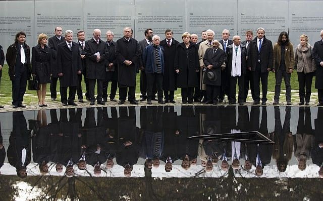 German Chancellor Angela Merkel, center right, attends the inauguration ceremony of the memorial to the murdered European Sinti and Roma who were persecuted as 'Gypsies' in Berlin, Wednesday, Oct. 24, 2012 (photo credit: AP/Markus Schreiber)
