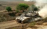 An IDF tank patrolling along the border of the Gaza Strip in 2011. (photo credit: Ilan Ben Zion/Times of Israel staff)