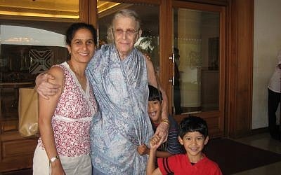 Cherian (left) visits her American-born mother, Elsie, with sons Reid (far right) and Cole during a 2006 trip to India. (Photo credit: Courtesy of Anne Cherian)