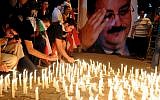 Lebanese mourners light candles during a vigil for Brig. Gen. Wissam al-Hassan and at least seven others who were killed in a Friday bomb attack in Beirut, Saturday, October 20, 2012. (photo credit: AP/Ahmad Omar)