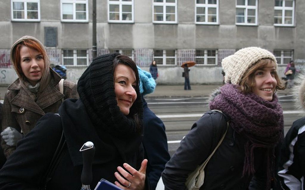 Martyna Majewska, center, guides a tour in Warsaw that shows former Jewish sites. (Marcin Kozlinski via JTA) Martyna Majewska, center, guides a tour in Warsaw that shows former Jewish sites. (Marcin Kozlinski via JTA)