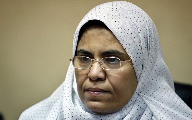 Sabah al-Saqari, 49, a senior member of the Freedom and Justice Party, the political arm of the Muslim Brotherhood, works at her office in the FJP's headquarters in Cairo, Egypt, Oct. 4 (photo credit: AP/Nasser Nasser) Sabah al-Saqari, 49, a senior member of the Freedom and Justice Party, the political arm of the Muslim Brotherhood, works at her office in the FJP's headquarters in Cairo, Egypt, Oct. 4 (photo credit: AP/Nasser Nasser)
