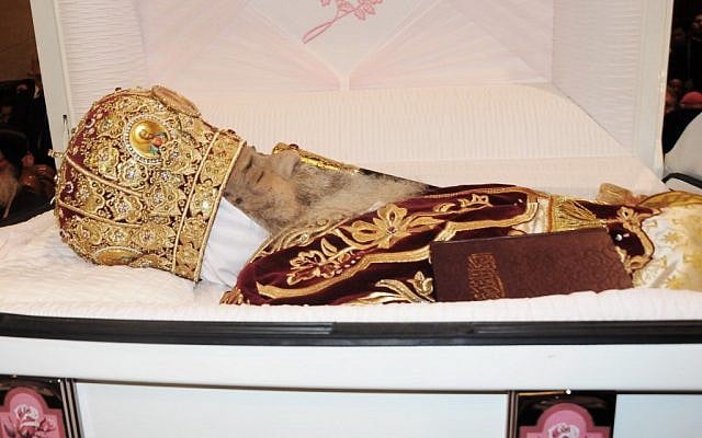 The body of Pope Shenouda III lies in a casket at the Coptic Orthodox cathedral during his funeral in Cairo, Egypt, in this Tuesday, March 20, 2012 file photo (photo credit: AP Photo/Mohammed Asad, file) The body of Pope Shenouda III lies in a casket at the Coptic Orthodox cathedral during his funeral in Cairo, Egypt, in this Tuesday, March 20, 2012 file photo (photo credit: AP Photo/Mohammed Asad, file)