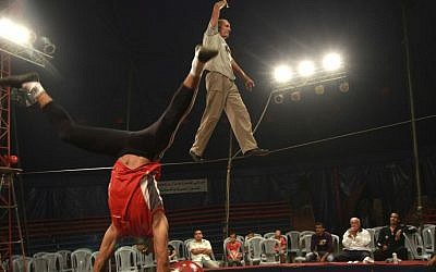 In this photo taken Thursday, Oct. 25, 2012, Mohammed Nassar, 33, left, and Adel Aly, 47, members of the Egyptian National Circus practice in Gaza City. (photo credit: AP)
