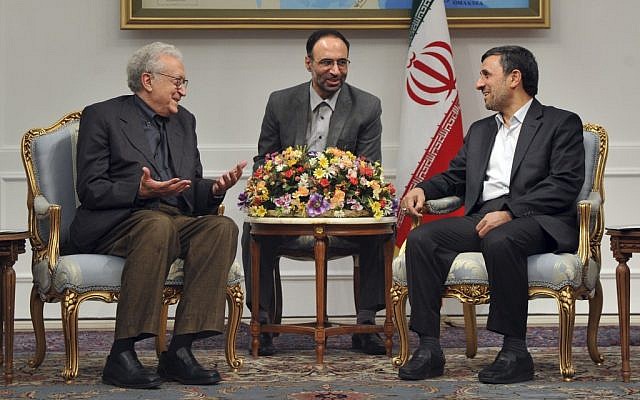 UN peace envoy to Syria, Lakhdar Brahimi, left, talks with Iranian President Mahmoud Ahmadinejad, during their meeting in Tehran, Iran, on Sunday, October 14, 2012. An unidentified interpreter sits at center (photo credit: AP/ISNA, Amir Pourmand)