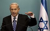 Prime Minister Benjamin Netanyahu announces early elections in a press conference Tuesday night (photo credit: AP/Bernat Armangue)