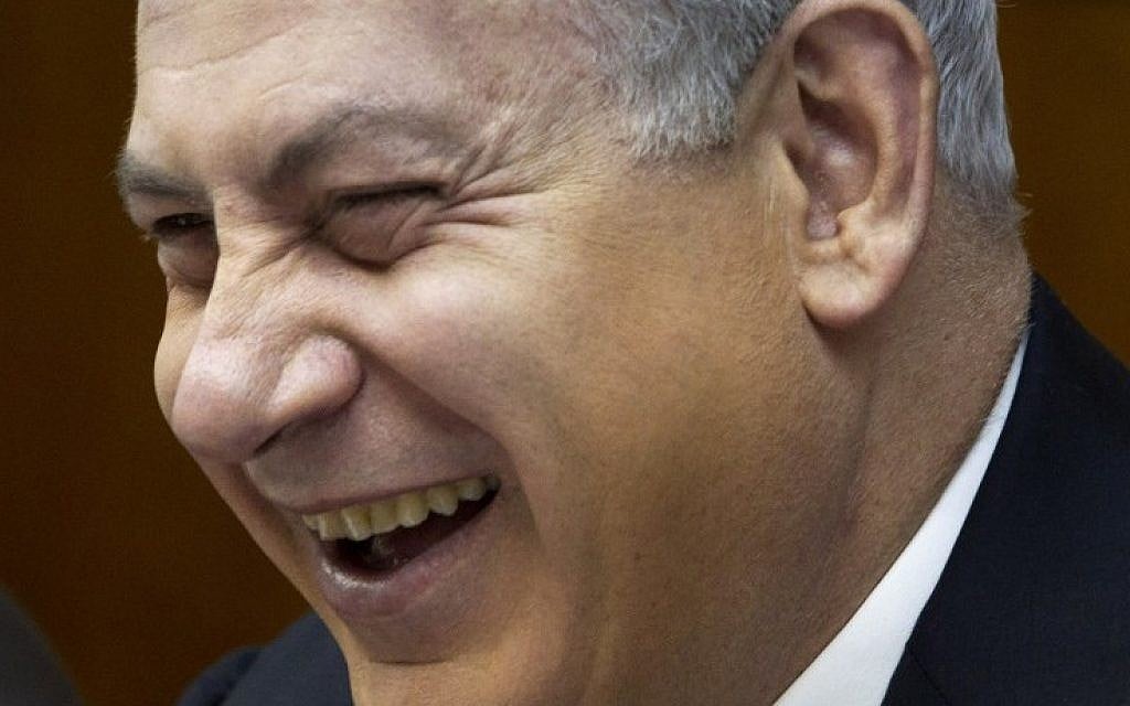 Prime Minister Benjamin Netanyahu laughs during a recent cabinet meeting (photo credit: AP/Jim Hollander) Prime Minister Benjamin Netanyahu laughs during a recent cabinet meeting (photo credit: AP/Jim Hollander)