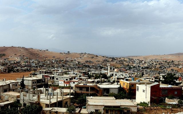 A view of Arsal, a Sunni Muslim town in eastern Lebanon near the Syrian border that has become a safe haven for war-weary Syrian rebels, a way station for wounded fighters and home to hundreds of frightened Syrian refugee families (photo credit: AP Photo/Bilal Hussein) A view of Arsal, a Sunni Muslim town in eastern Lebanon near the Syrian border that has become a safe haven for war-weary Syrian rebels, a way station for wounded fighters and home to hundreds of frightened Syrian refugee families (photo credit: AP Photo/Bilal Hussein)