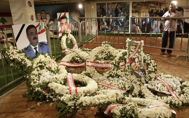 A Lebanese man prays at the grave of Brig. Gen. Wissam al-Hassan and his bodyguard, Ahmad Sahyouni, who were assassinated on Friday by a car bomb, in Beirut, Lebanon, Monday, October 22, 2012 (photo credit: AP/Maya Alleruzzo) A Lebanese man prays at the grave of Brig. Gen. Wissam al-Hassan and his bodyguard, Ahmad Sahyouni, who were assassinated on Friday by a car bomb, in Beirut, Lebanon, Monday, October 22, 2012 (photo credit: AP/Maya Alleruzzo)
