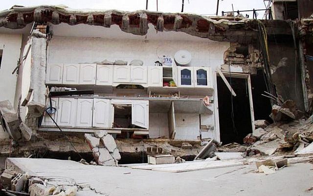 A house destroyed by Syrian government shelling in Homs province, Syria on Thursday (photo credit: AP/Lens Yong Homsi)